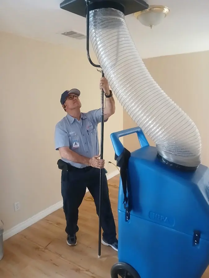 Furnace Tune-Up technician using HEPA equipment in Wauchula